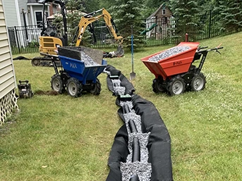 French drain installation with gravel trench and perforated pipe